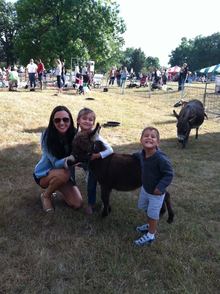 The Serene Oaks Dental team at the Farm Fest Petting Zoo