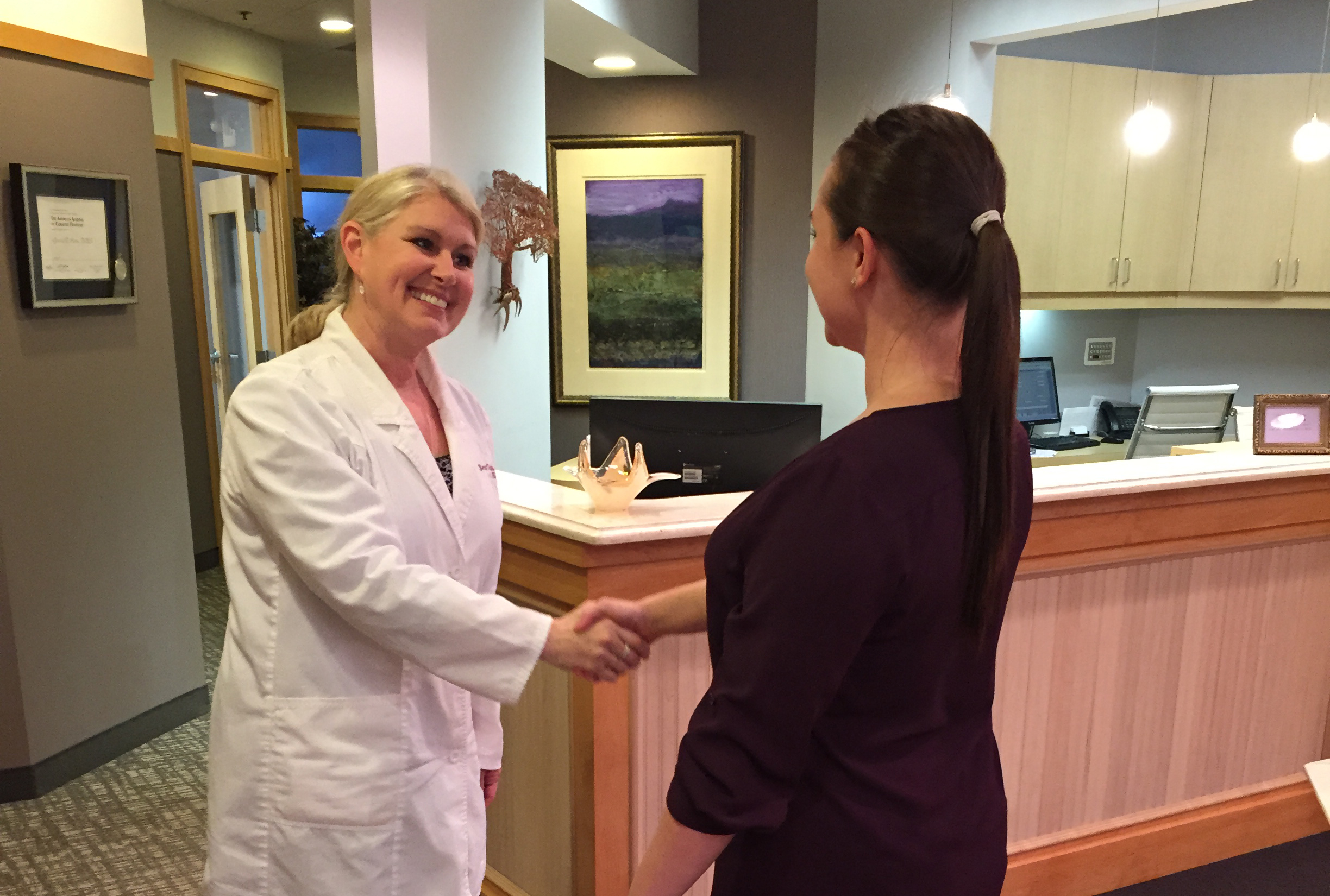 The staff at Serene Oaks Dental talking to a patient