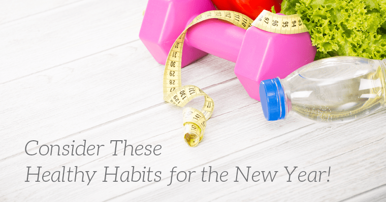 A weight, measuring tape, and healthy food represent starting healthy habits for the new year