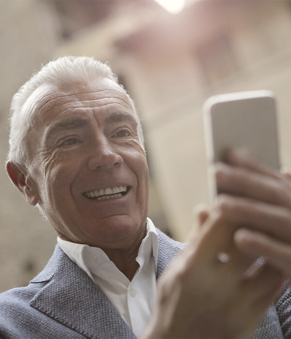 An older man requesting a virtual consultation for cosmetic dentistry in Minneapolis