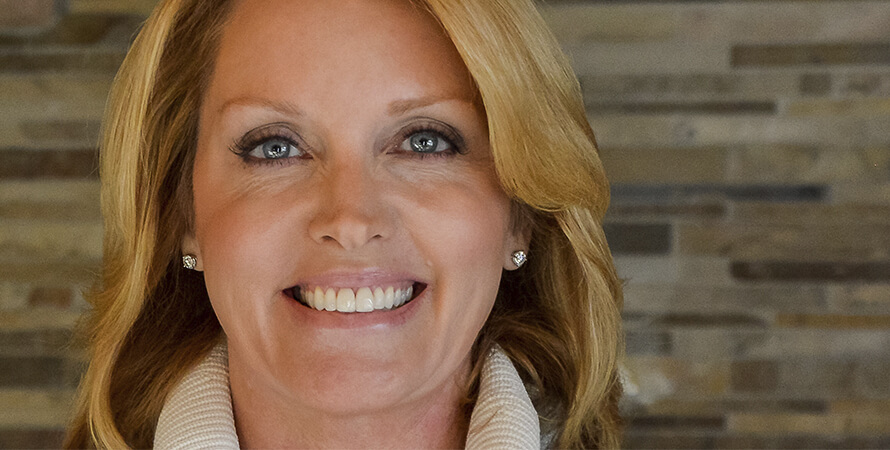 Close up of a blond woman smiling