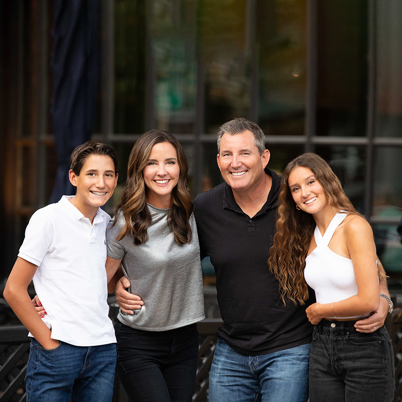 Minneapolis Cosmetic dentist, Dr. Gesica Horn, standing and smiling with her family